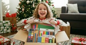 a girl opening a christmas present