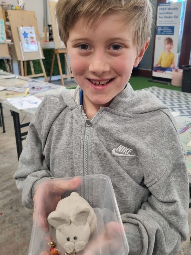 boy with clay creation